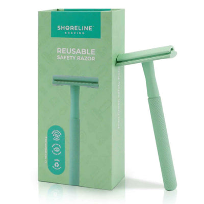Mint Green Safety Razor Leaning On Gift Box